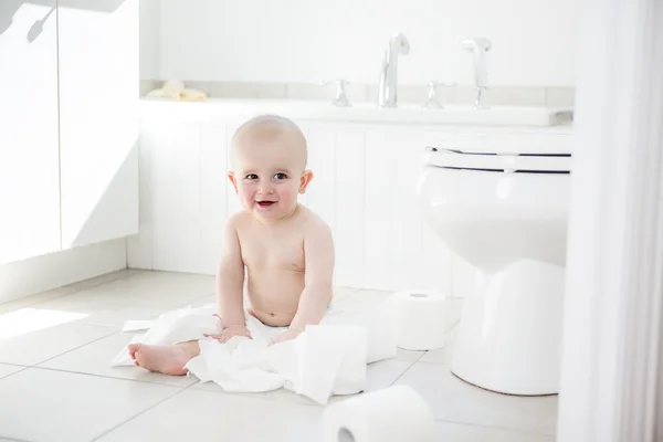 Adorable baby boy playing with toilet paper — Stock Photo, Image