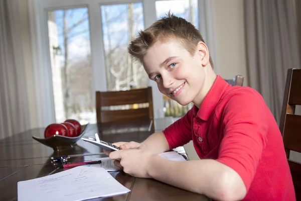 Boy doing his homework at home — Stock Photo, Image