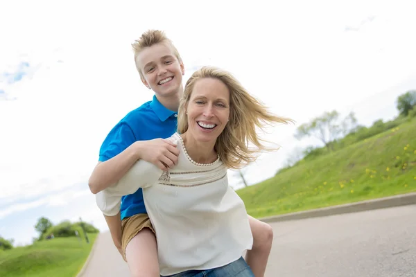 Happy family mother and herson spending time outdoor on a summer day — Stock Photo, Image