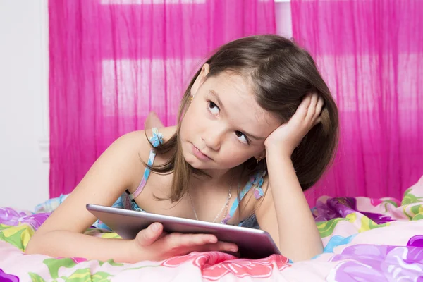 Technologies become easier. Cute little girl holding digital tablet — Stock Photo, Image