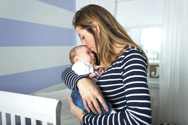 Young mother with a charming baby — Stock Photo, Image