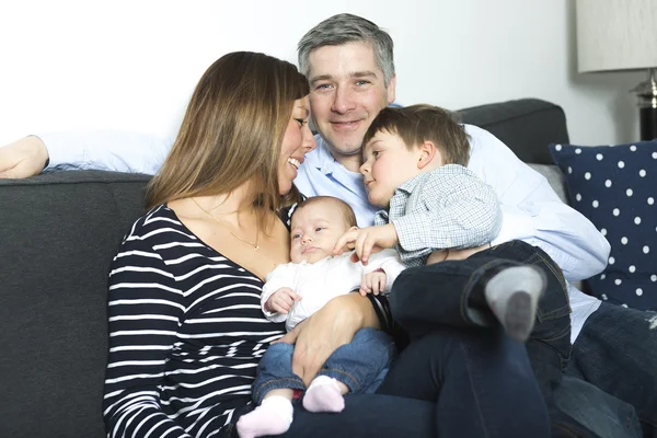 Happy family mother, father and two children at home — Stock Photo, Image