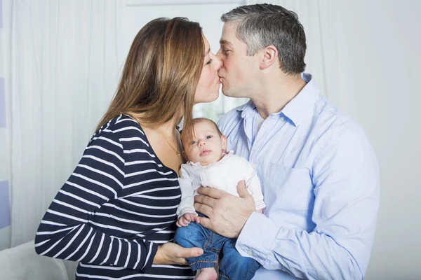 Proud Parents Holding Baby in the bedroom — Stock Photo, Image