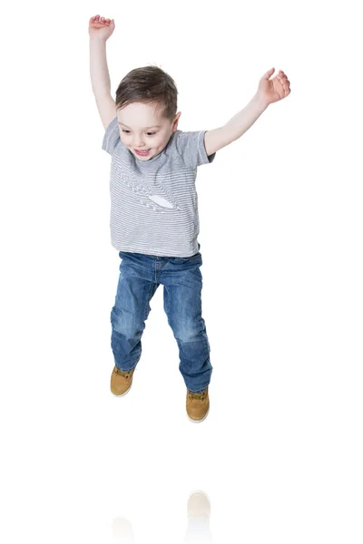 Niño pequeño saltando en el aire Fotos De Stock Sin Royalties Gratis