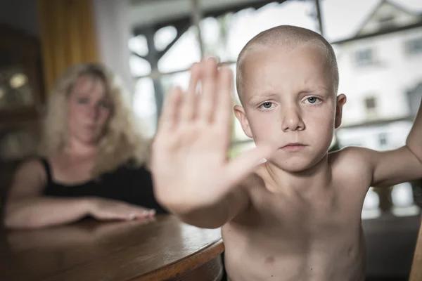 Cara triste niño y mano levantar para detener o proteger — Foto de Stock