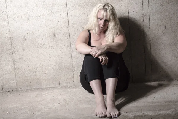 Depress woman person with concrete background — Stock Photo, Image