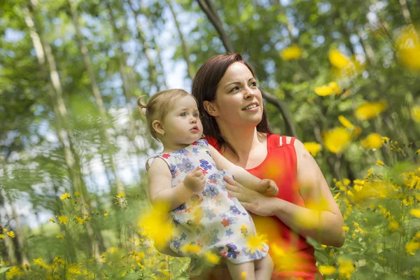Mother and daughter in forest having fun — Stock Photo, Image