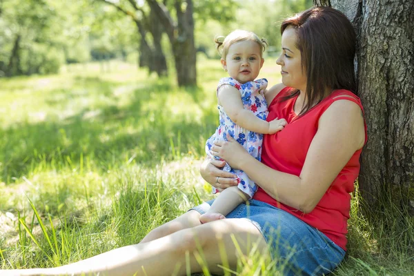 Mother and daughter in forest having fun — Stock Photo, Image