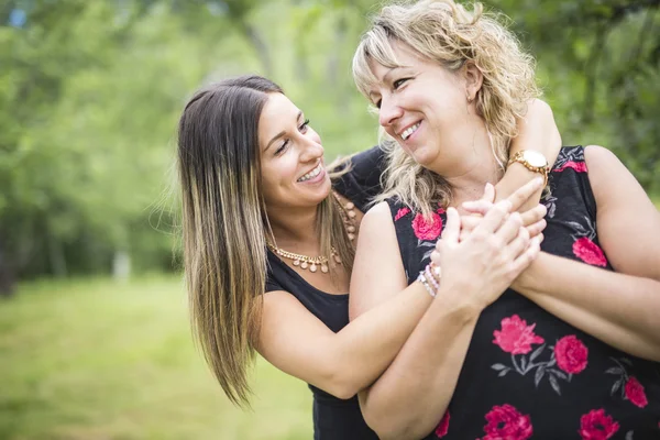 Adult mother and daughter outside in forest — Stock Photo, Image