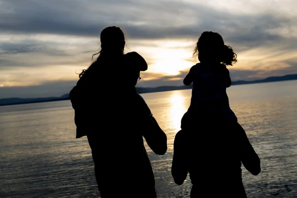 Portrait of happy beautiful family  four together at sunset — Stock Photo, Image