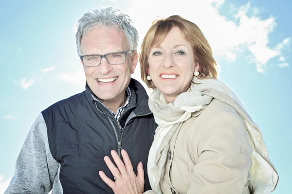 Portrait of happy senior couple in winter season — Stock Photo, Image