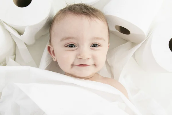 Toddler ripping up toilet paper in bathroom studio — Stock Photo, Image