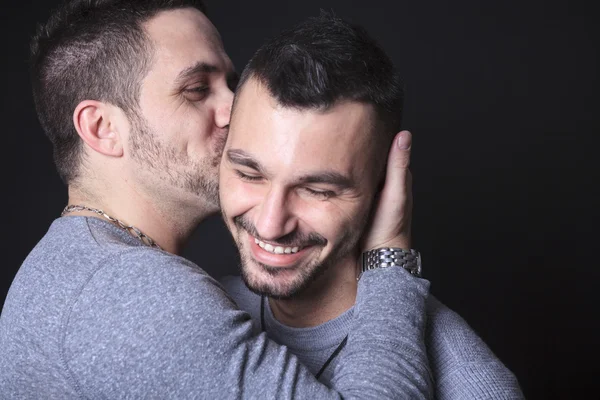 Gay couple on black background — Stock Photo, Image