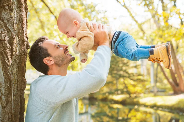 Father and baby having fun in the forest — Stock Photo, Image
