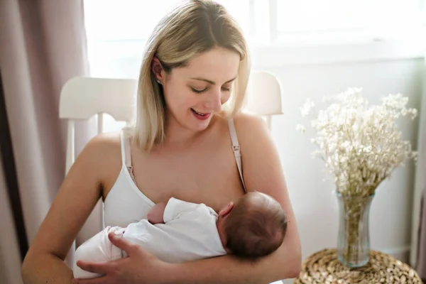 Mother and new born girl breast feeding baby — Stock Photo, Image