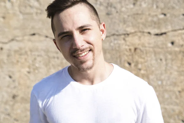 Young handsome hipster man in the city — Stock Photo, Image