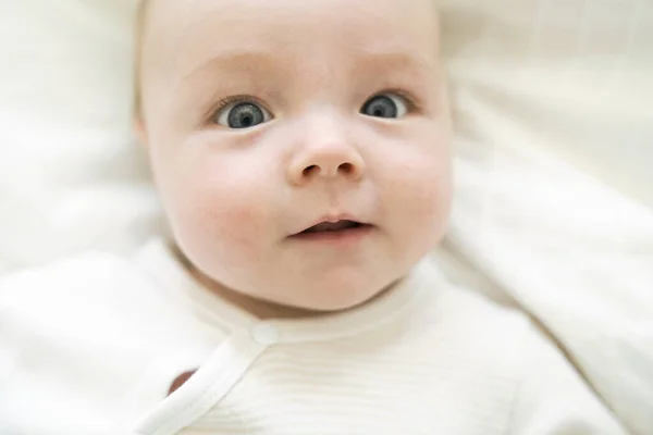 Cute two month old baby in bed at home — Stock Photo, Image