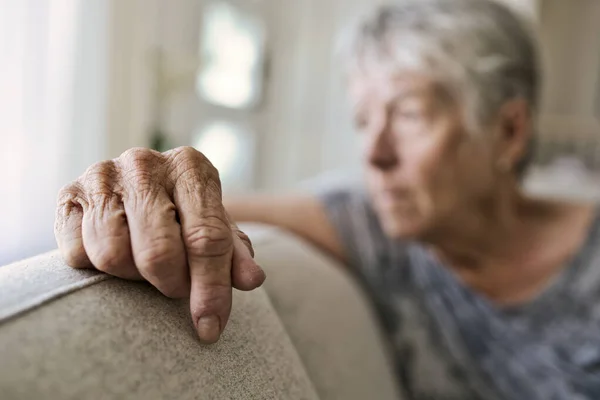 Close portrait of senior hand Woman On Sofa Suffering From Depression — Stock Photo, Image