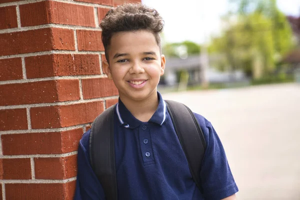 The Great Portrait Of School Pupil Outside Classroom Carrying Bags — Stock Photo, Image