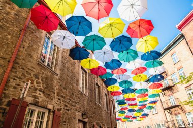 Lot of Umbrellas in Petit Champlain street Quebec city clipart