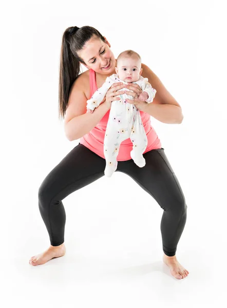 Sport motherhood and active lifestyle of young mother workout together with her baby — Stock Photo, Image