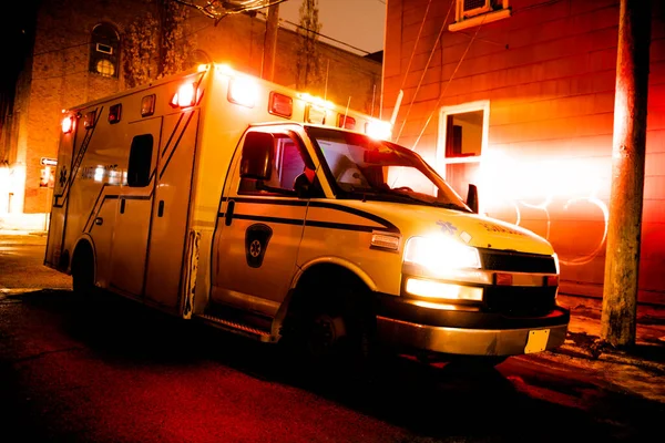 An ambulance car parked on the side street at night — Stock Photo, Image