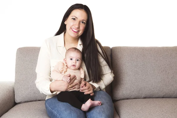 A nice Mother with baby girl on the sofa — Stock Photo, Image