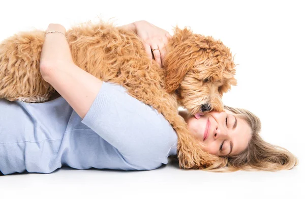 Woman with his Golden Labradoodle dog isolated on white background — Stock Photo, Image