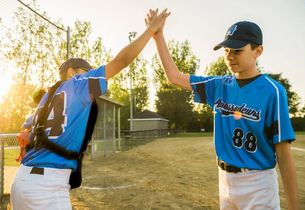 Two childrens baseball players standing together on the playground — Stock Photo, Image