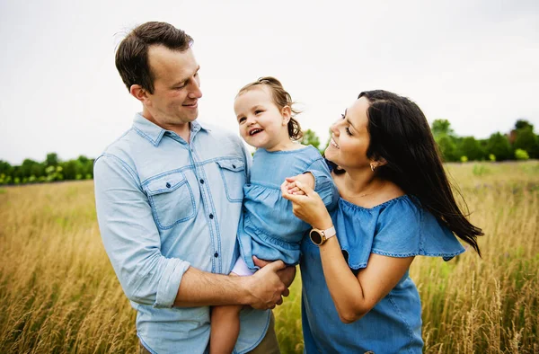 Portrait of a happy young family in the countryside — Stock Photo, Image