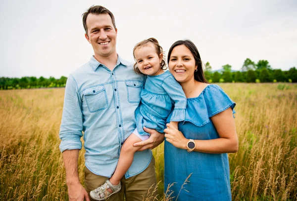 Portrait of a happy young family in the countryside — Stock Photo, Image