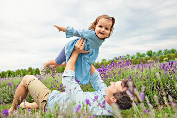 Happy family father and daughter having fun in lavender field — Stock Photo, Image