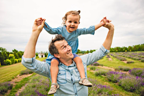 Happy family father and daughter having fun in lavender field — Stock Photo, Image