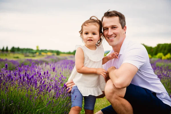 Happy family father and daughter having fun in lavender field — Stock Photo, Image