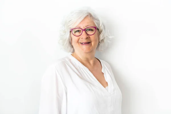 A Senior woman studio isolated on grey wall laughing cheerful — Stock Photo, Image