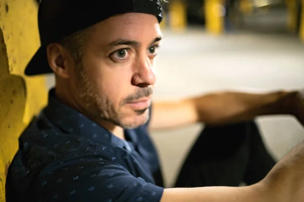 A portrait of a man inside basement at night — Stock Photo, Image