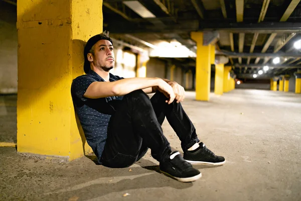 A portrait of a man inside basement at night — Stock Photo, Image