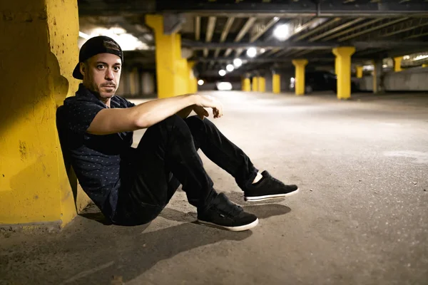 A portrait of a man inside basement at night — Stock Photo, Image