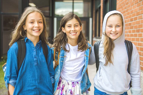 Some nice kids on the school background having fun — Stock Photo, Image