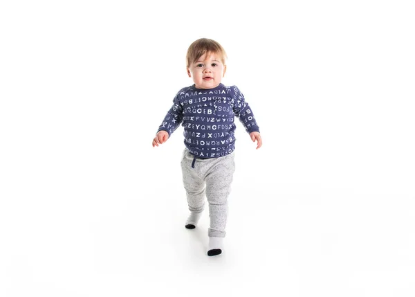 A One year old boy walk on studio white background — Stock Photo, Image