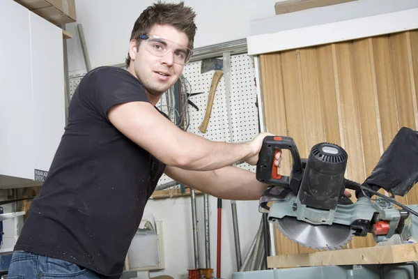 Carpenter at work on job using power tool — Stock Photo, Image