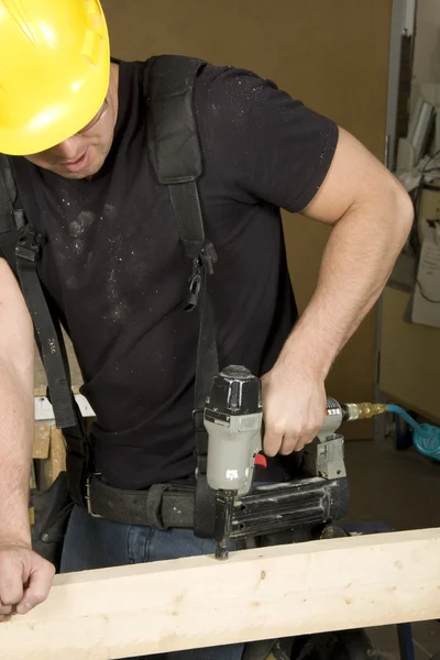 Carpenter at work on job using power tool — Stock Photo, Image