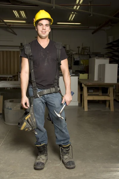 Carpenter at work on job using power tool — Stock Photo, Image