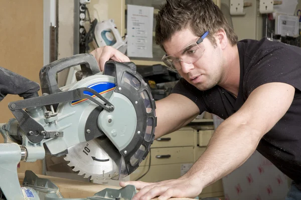 Carpenter at work on job using power tool — Stock Photo, Image