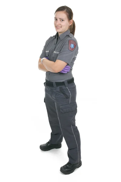 Dipendente paramedico nella parte anteriore di uno sfondo bianco — Foto Stock