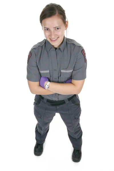 Dipendente paramedico nella parte anteriore di uno sfondo bianco — Foto Stock