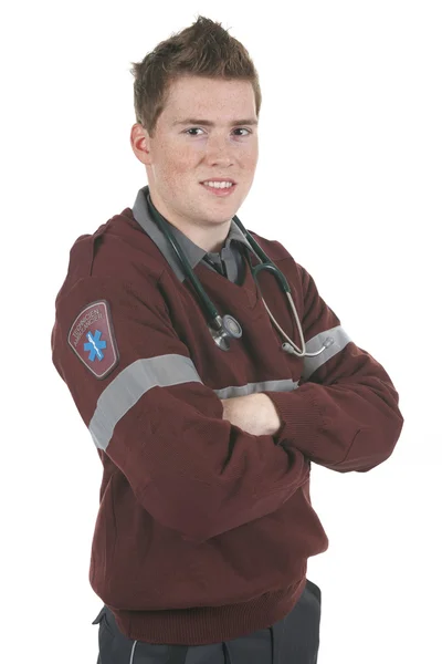 Empleado paramédico en el frente de un fondo blanco —  Fotos de Stock
