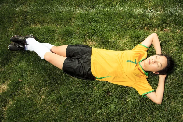 Portrait of young Asian girl with soccer ball. — Stock Photo, Image