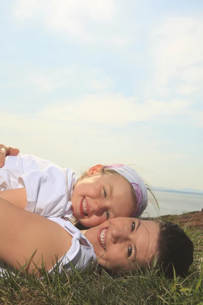 A mother and daughter having fun outside — Stock Photo, Image