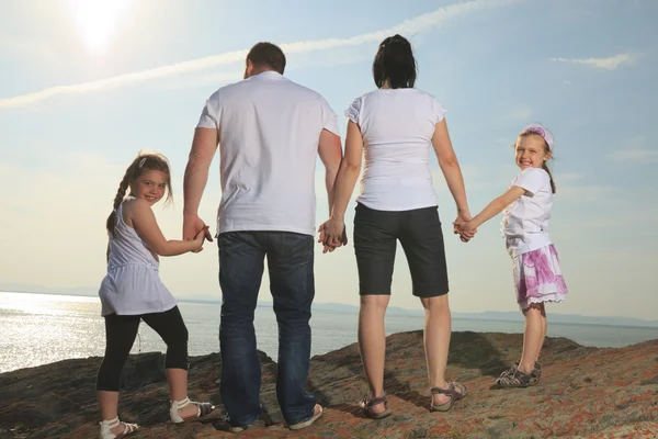 Good time family in front of ocean — Stock Photo, Image